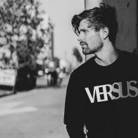 Stylish black and white portrait of a male model in urban Los Angeles setting.