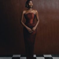 A stunning portrait of a woman in traditional Nigerian fashion, showcasing elegance and cultural style.