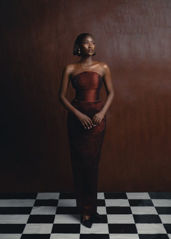 A stunning portrait of a woman in traditional Nigerian fashion, showcasing elegance and cultural style.
