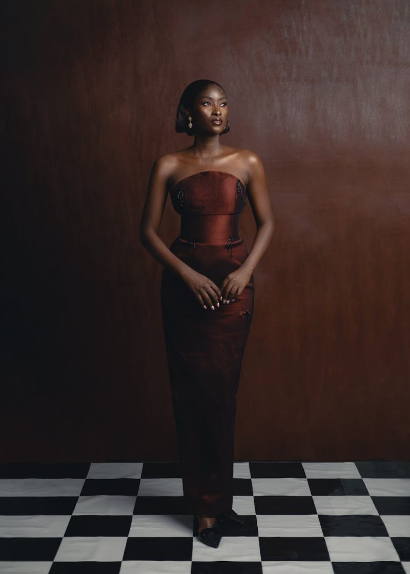 A stunning portrait of a woman in traditional Nigerian fashion, showcasing elegance and cultural style.