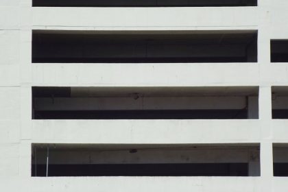 Close-up of a modern concrete building facade with architectural patterns.