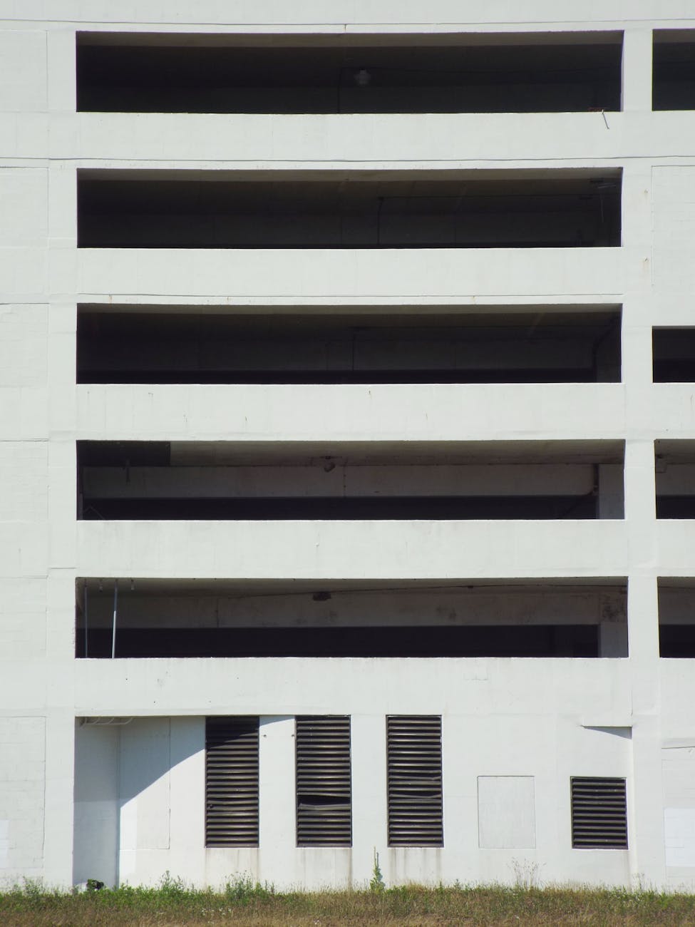 Close-up of a modern concrete building facade with architectural patterns.
