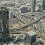 Explore Dubai's intricate roadways and futuristic skyline in this stunning aerial shot.