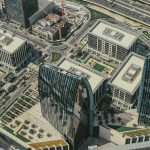 A stunning aerial capture of Dubai's modern business district with prominent skyscrapers.