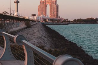 Captivating view of Abu Dhabi's iconic architecture during sunset by the waterfront.