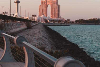 Captivating view of Abu Dhabi's iconic architecture during sunset by the waterfront.