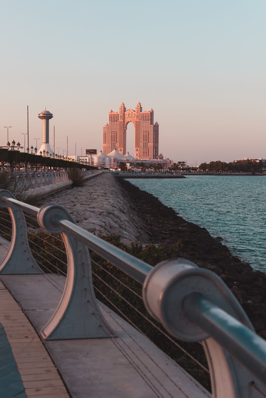 Captivating view of Abu Dhabi's iconic architecture during sunset by the waterfront.