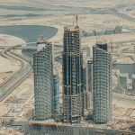Aerial view of construction in downtown Dubai showcasing modern skyscrapers and urban development.