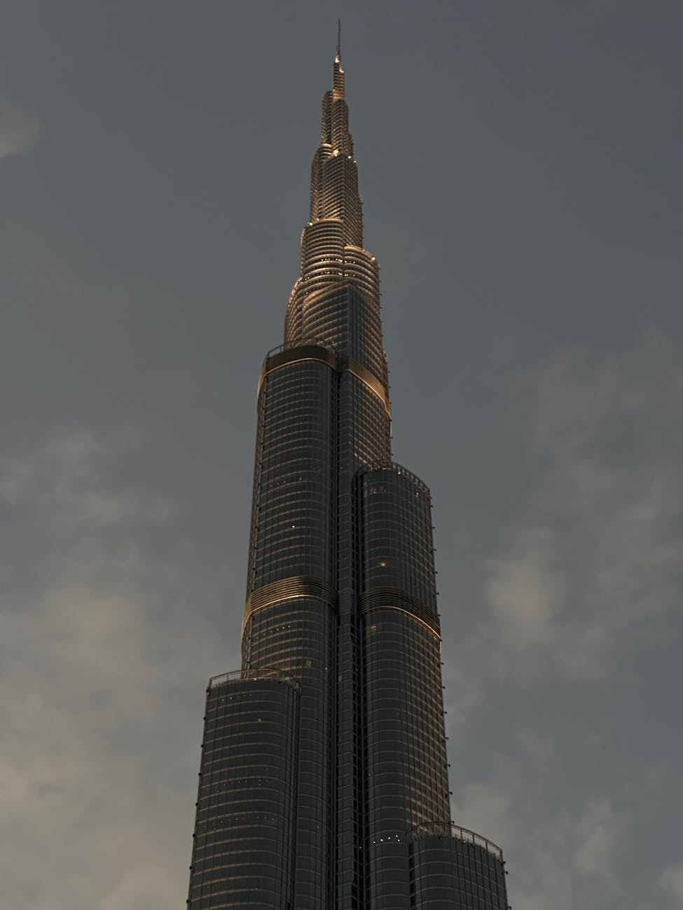 Stunning architectural view of Burj Khalifa in Dubai during twilight, showcasing its grandeur.